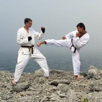 Pixwords The image with fighters, karate, men, rocks, cliff, sea, water Dmitri Maruta - Dreamstime