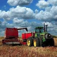 Pixwords The image with tractor, sky, clouds, field Lorraine Swanson (Pixart)