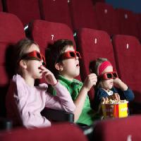 Pixwords The image with kids, watch, film, popcorn, seats, red Agencyby - Dreamstime